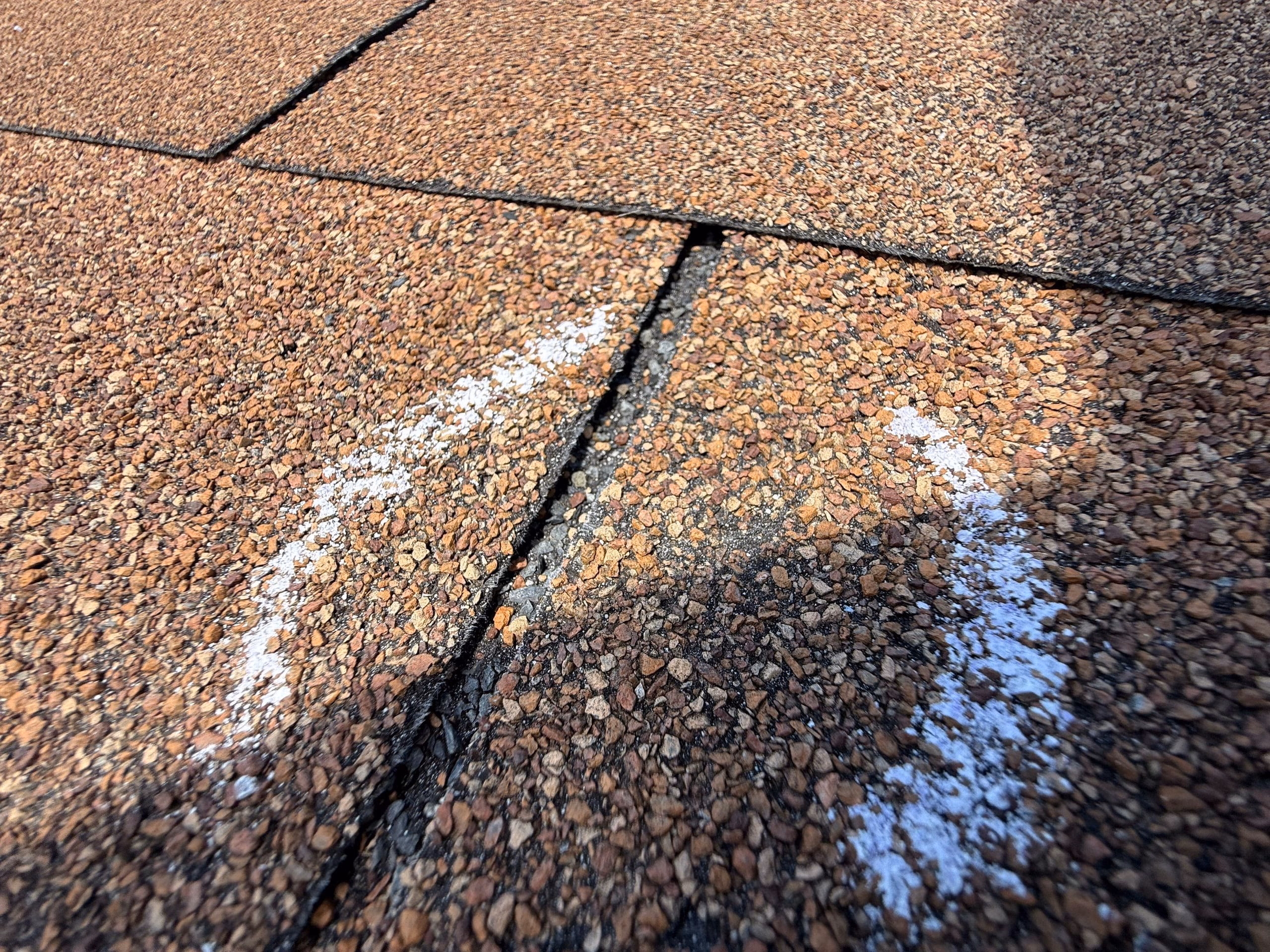 Chalk circles marking a hail hit during a hail damage inspection in Austin, TX